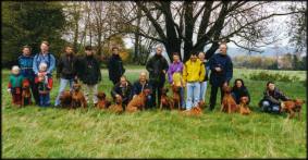 Heshima ya Kimba puppies and their owners